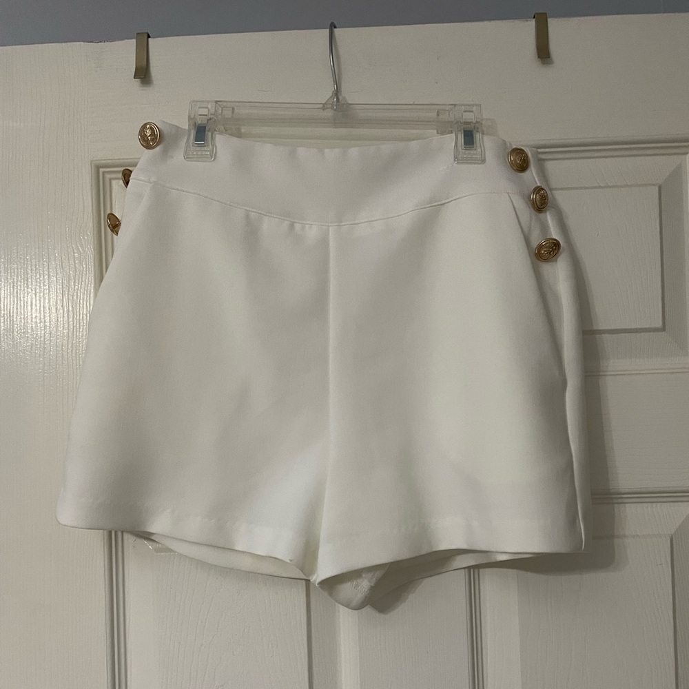 Do + Be cream shorts with gold buttons on the side and pockets